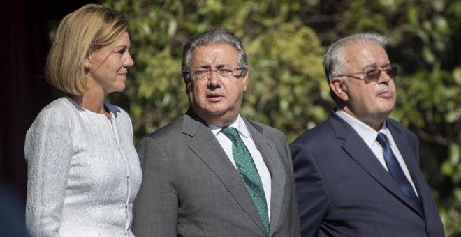 El ministro del Interior, Juan Ignacio Zoido,c., y el director general de la Guardia Civil, Juan Manuel Holgado,d., y la ministra de Defensa, Maria Dolores de Cospedal, en el acto central de la festividad de la patrona de la Guardia Civil,celebrado hoy en