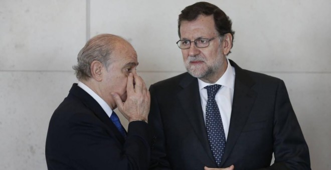 El expresidente del Gobierno Mariano Rajoy y el exministro del Interior Jorge Fernández Díaz en una imagen de archivo. EFE