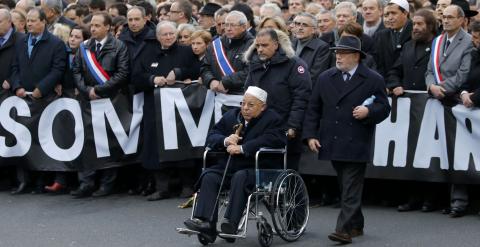 Paris Mosque rector Dalil Boubakeur (C), French political, religious and personalites take part in a solidarity march (Marche Republicaine) in the streets of Paris January 11, 2015. Hundreds of thousands of French citizens will be joined by dozens of fore