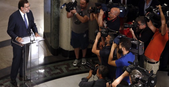 El presidente del Gobierno en funciones, Mariano Rajoy, durante la rueda de prensa que ha ofrecido en el Congreso tras la reunión con el líder de Ciudadanos, Albert Rivera. EFE/Chema Moya