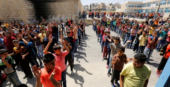 Una escuela de niños refugiados en Jordania, en su primer día de clases/REUTERS