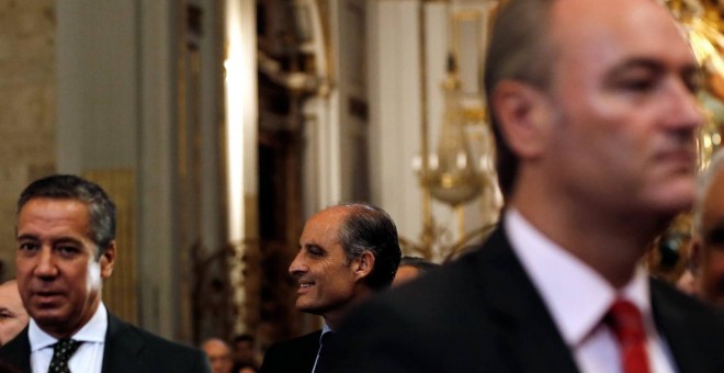 Los expresidents de la Generalitat valenciana Alberto Fabra (d), Eduardo Zaplana (i) y Francisco Camps (c), en la ceremonia de toma posesión como arzobispo de Valencia de Antonio Cañizares. EFE