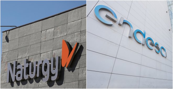 Los logos de las eléctricas Naturgy (antigua Gas Natural Fenosa) y Endesa, en sus sedes en Madrid. REUTERS