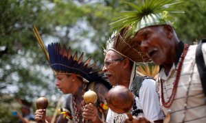 FILE PHOTO: Indigenous people from various tribes dance as they wait to deliver a letter to Brazil's President-elect Jair Bolsonaro at a transitional government building in Brasilia, Brazil, December 6, 2018. REUTERS/Adriano Machado/File Photo