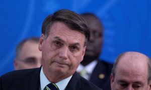 El presidente de Brasil, Jair Bolsonaro, ofrece una rueda de prensa este viernes, en Brasilia (Brasil).  EFE/ Joédson Alves