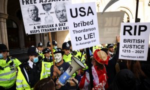 Supporters of Wikileaks founder Julian Assange protest outside the Royal Courts of Justice in London, Britain, October 27, 2021. REUTERS/Henry Nicholls