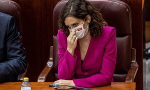 La presidenta de la Comunidad de Madrid, Isabel Díaz Ayuso, asiste al pleno de la Asamblea de Madrid, este jueves.