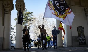 Varias personas participan en una marcha neonazi en Madrid, a 13 de febrero de 2021.