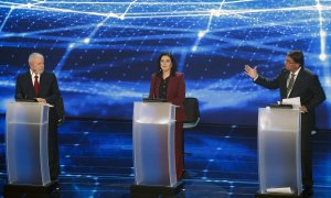 Brazilian presidential candidates (L to R) Luiz Inacio Lula da Silva (PT), Simone Tebet (MDB), Jair Bolsonaro (PL) take part in the presidential debate ahead of the October 2 general election at Bandeirantes television network in Sao Paulo, Brazil, on Aug