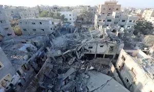 Un edificio dañado tras un ataque israelí en el campamento de refugiados de Nuseirat, en la Franja de Gaza, a 30/12/2023