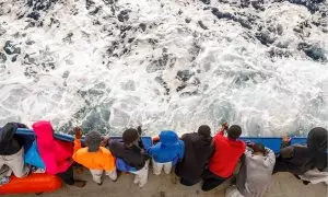 Un grupo de menores migrantes en una embarcación, tras ser rescatados por las autoridades españolas.