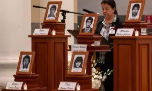 Urns holding the remains of five students killed by a military squad during a raid at a university campus 31 years ago are displayed during a religious ceremony in their honour on September 1, 2023, in Lima, after the remains were handed over to relatives