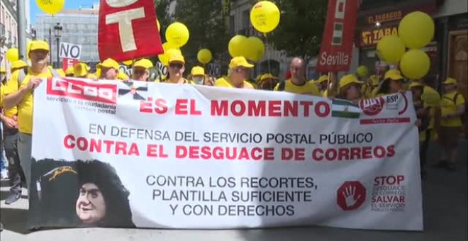 Protestas de Correos y taxistas en Madrid